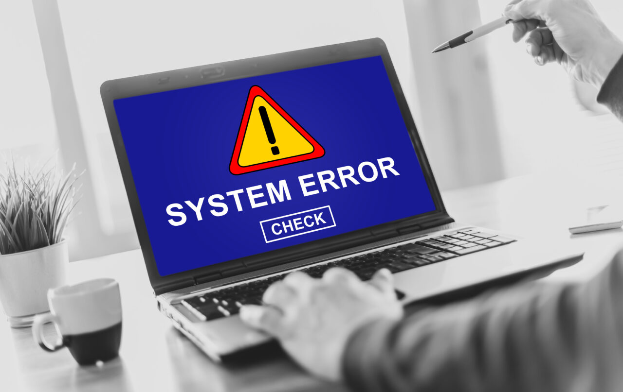 Laptop screen displaying a system error concept